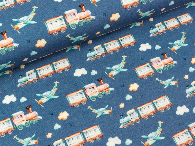 Baumwolljersey Nora Eisenbahn und Hubschrauber bunt auf Jeansblau