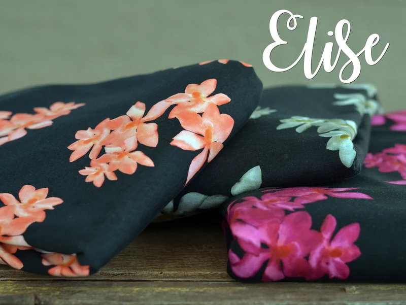 Baumwolljersey Elise Magnolienblüten weiß auf Schwarz by Bienvenido Colorido