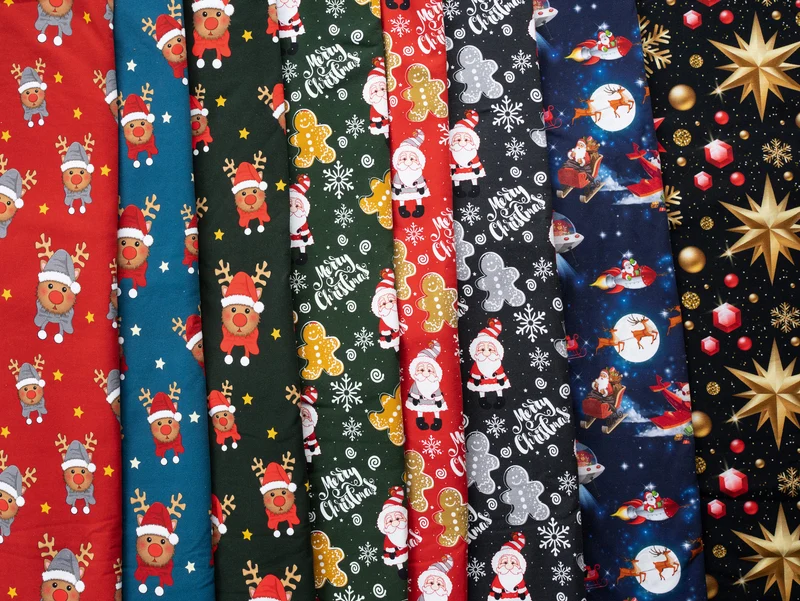 Baumwollsweat Toronto Weihnachtszauber bunt auf Schwarz
