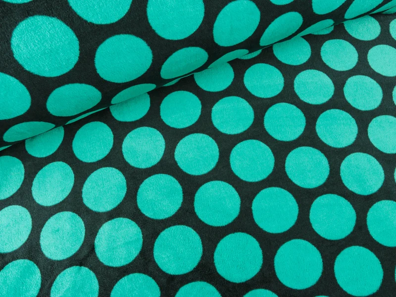 Wellnessfleece Buffy Megadots smaragdgrün auf Schwarz