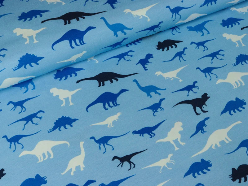 Reststück 100cm - Baumwolljersey Dinosaurier auf Hellblau
