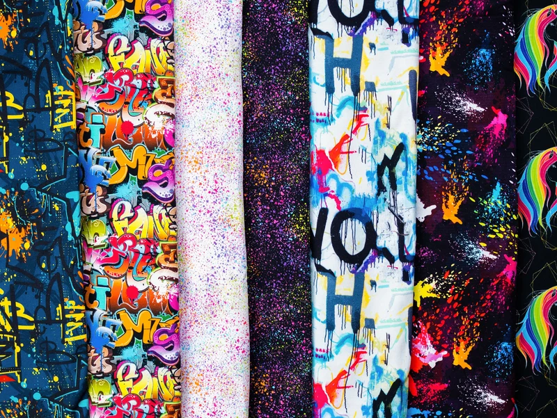 Reststück 24cm - Baumwollsweat Toronto Bunte Sprenkel auf Schwarz