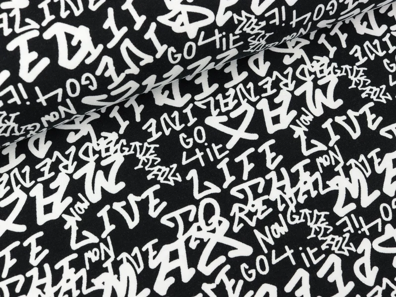 Baumwolljersey Confetti Buchstaben weiß auf Schwarz