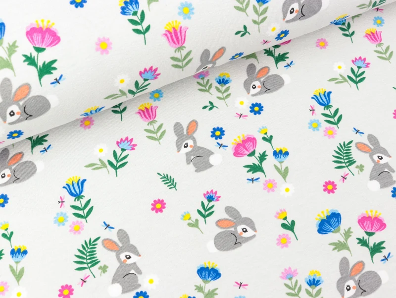 Baumwolljersey Kleine Häschen in der bunten Blumenwiese auf Lichtgrau