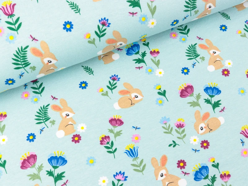 Baumwolljersey Kleine Häschen in der bunten Blumenwiese auf Wasserblau